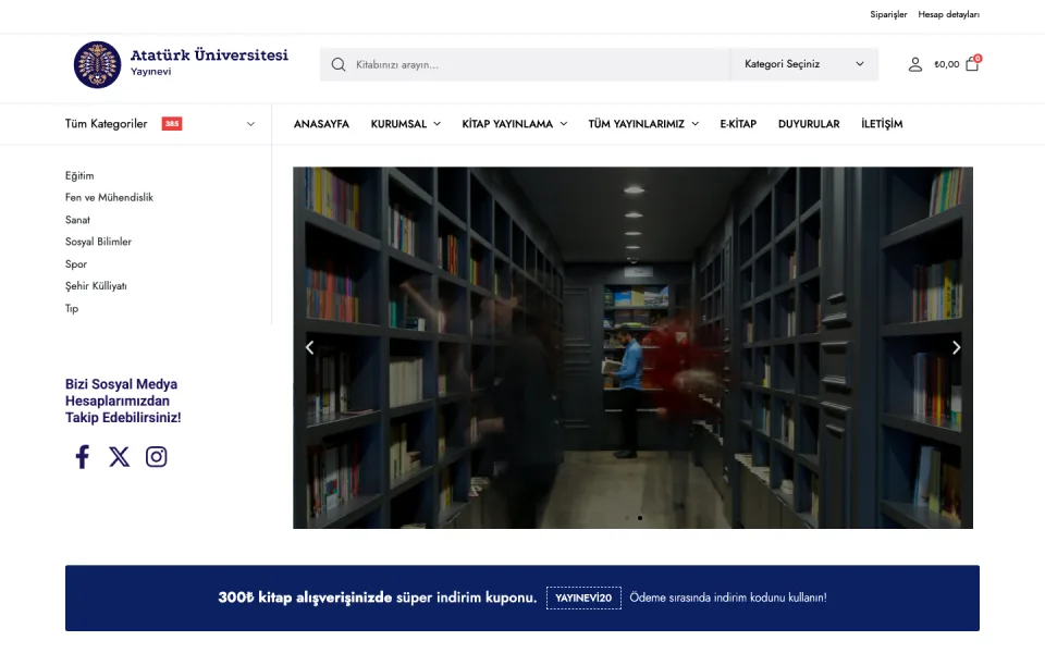 Atatürk Üniversitesi Yayınevi web sitesinin ana sayfası. Üstte logo, arama çubuğu ve menüler; solda kitap kategorileri; merkezde kütüphane görseli ve altta indirim kuponu bandı yer alıyor.