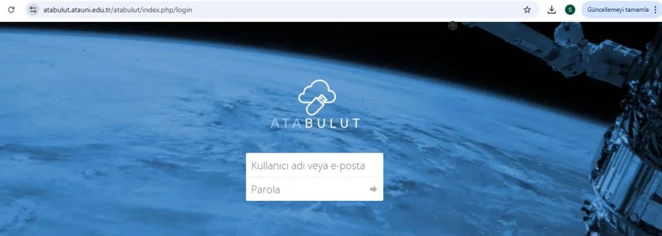 Dünya uzaydan görünürken ön planda ATABULUT logosu ile kullanıcı adı ve parola giriş alanlarının bulunduğu giriş ekranı.